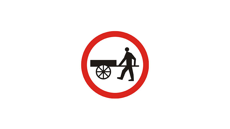 Znak B-12. Zakaz wjazdu wózków ręcznych.